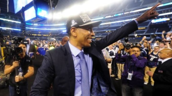 Apr 7, 2014; Arlington, TX, USA; Connecticut Huskies head coach Kevin Ollie gestures to fans after defeating the Kentucky Wildcats in the championship game of the Final Four in the 2014 NCAA Mens Division I Championship tournament at AT&T Stadium. Mandatory Credit: Bob Donnan-USA TODAY Sports
