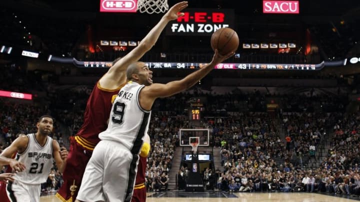 Jan 14, 2016; San Antonio, TX, USA; San Antonio Spurs point guard Tony Parker (9) shoots the ball past Cleveland Cavaliers center Timofey Mozgov (20, left) during the first half at AT&T Center. Mandatory Credit: Soobum Im-USA TODAY Sports