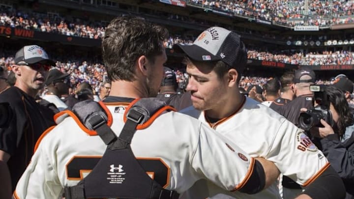 Oct 2, 2016; San Francisco, CA, USA; San Francisco Giants starting pitcher Matt Moore (45) and catcher Buster Posey (28) celebrate cinching the wild card against the Los Angeles Dodgers at AT&T Park the San Francisco Giants defeated the Los Angeles Dodgers 7 to 1. Mandatory Credit: Neville E. Guard-USA TODAY Sports