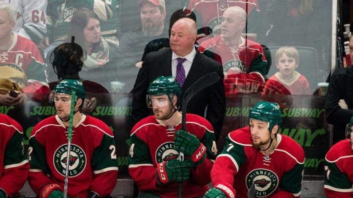 Dec 17, 2016; Saint Paul, MN, USA; Minnesota Wild head coach Bruce Boudreau (C) looks on from behind the bench during the third period against the Arizona Coyotes at Xcel Energy Center. The Wild won 4-1. Mandatory Credit: Brace Hemmelgarn-USA TODAY Sports