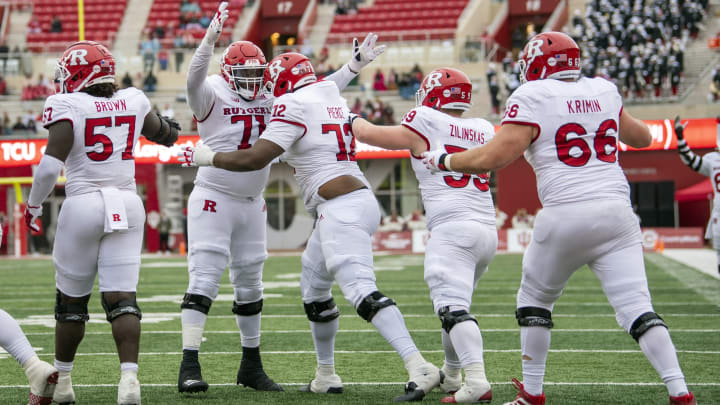 Nov 13, 2021; Bloomington, Indiana, USA; Rutgers Scarlet Knights offensive lineman Raiqwon O’Neal (71) celebrates his touchdown with his teammates during the second half against the Indiana Hoosiers at Memorial Stadium. The Scarlet Knights won 38-3. Mandatory Credit: Marc Lebryk-USA TODAY Sports