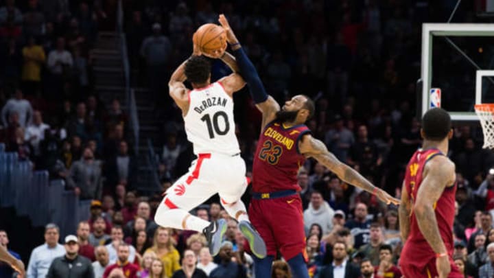 CLEVELAND, OH – MARCH 21: DeMar DeRozan #10 of the Toronto Raptors tries to take a last second shot over LeBron James #23 of the Cleveland Cavaliers during the second half at Quicken Loans Arena on March 21, 2018 in Cleveland, Ohio. The Cavaliers defeated the Raptors 132-129. NOTE TO USER: User expressly acknowledges and agrees that, by downloading and or using this photograph, User is consenting to the terms and conditions of the Getty Images License Agreement. (Photo by Jason Miller/Getty Images) *** Local Caption *** DeMar DeRozan; LeBron James