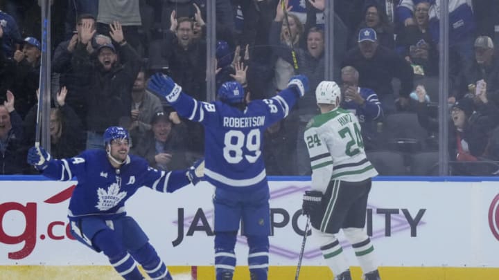 Oct 20, 2022; Toronto, Ontario, CAN; Toronto Maple Leafs left wing Nicholas Robertson (89) scores the winning goal and celebrates with Toronto Maple Leafs center Auston Matthews (34) against the Dallas Stars during the overtime period at Scotiabank Arena. Mandatory Credit: Nick Turchiaro-USA TODAY Sports