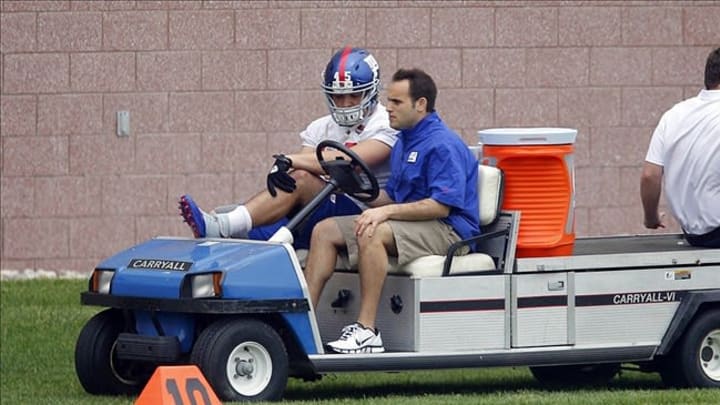 May 22, 2013; East Rutherford, NJ, USA; New York Giants fullback Henry Hynoski (45) is taken off the field after being injured during the New York Giants organized team activities at the Giants Timex Performance Center. Mandatory Credit: Jim O