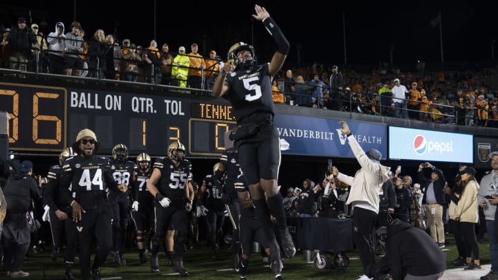 Nov 26, 2022; Nashville, Tennessee, USA;Vanderbilt Commodores quarterback Mike Wright (5) leads the team onto the field before a game against the Tennessee Volunteers at FirstBank Stadium. Mandatory Credit: George Walker IV – USA TODAY Sports