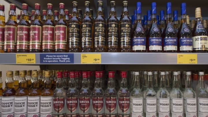 CARDIFF, UNITED KINGDOM - SEPTEMBER 17: Bottles of alcohol on sale in a UK supermarket on September 17, 2015 in Cardiff, United Kingdom. A new law setting a minimum alcohol price came into force on March 2 under Welsh Government plans. Retailers and bars have to charge a minimum of 50p per unit, meaning a can of cider could cost at least £1 and a bottle of wine £4.69. A similar system in Scotland has seen alcohol sales fall to the lowest levels since records began. (Photo by Matthew Horwood/Getty Images)