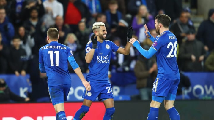 LEICESTER, ENGLAND – JANUARY 01: Riyad Mahrez of Leicester City celebrates scoring the opening goal with Christian Fuchs (R) during the Premier League match between Leicester City and Huddersfield Town at The King Power Stadium on January 1, 2018 in Leicester, England. (Photo by Clive Mason/Getty Images)