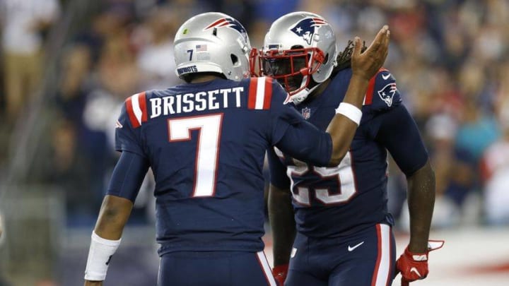 Sep 22, 2016; Foxborough, MA, USA; New England Patriots running back LeGarrette Blount (29) celebrates with quarterback Jacoby Brissett (7) after a touchdown during the fourth quarter against the Houston Texans at Gillette Stadium. The Patriots won 27-0. Mandatory Credit: Greg M. Cooper-USA TODAY Sports