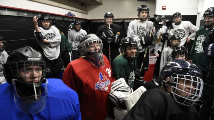 WESTMINSTER, CO - FEBRUARY 21: Girls playing in hockey has become quite popular. The Lady Rough Riders listen to catch Jordan Slavin in the locker room before their practice February 21, 2016 at the Ice Center at the Promenade. The growth of hockey in Colorado has gone up in the last 20 years since The Avalanche came to town. (Photo By John Leyba/The Denver Post via Getty Images)