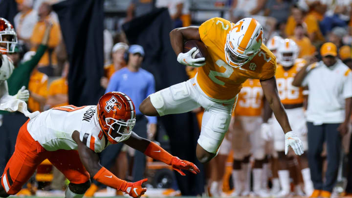 Sep 2, 2021; Knoxville, Tennessee, USA; Bowling Green Falcons safety Jordan Anderson (0) trips up Tennessee Volunteers running back Jabari Small (2) during the second half at Neyland Stadium. Mandatory Credit: Randy Sartin-USA TODAY Sports