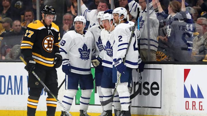 Andreas Johnsson #18 of the Toronto Maple Leafs and Ron Hainsey #2 celebrate with Kasperi Kapanen #24 of the Toronto Maple Leafs after he scored a goal as John Moore #27 of the Boston Bruins looks on during the third period of Game Five of the Eastern Conference First Round during the 2019 NHL Stanley Cup Playoffs at TD Garden. (Photo by Maddie Meyer/Getty Images)