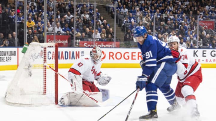 TORONTO, ON – DECEMBER 23: John Tavares #91 of the Toronto Maple Leafs goes to the net against Jaccob Slavin #74 of the Carolina Hurricanes during the first period at the Scotiabank Arena on December 23, 2019 in Toronto, Ontario, Canada. (Photo by Mark Blinch/NHLI via Getty Images)
