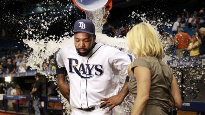Jun 12, 2015; St. Petersburg, FL, USA; Tampa Bay Rays designated hitter Joey Butler (9) gets a Gatorade bath after they beat the Chicago White Sox at Tropicana Field. Tampa Bay Rays defeated the Chicago White Sox 7-5. Mandatory Credit: Kim Klement-USA TODAY Sports