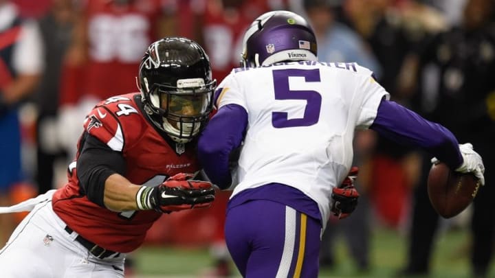 Nov 29, 2015; Atlanta, GA, USA; Minnesota Vikings quarterback Teddy Bridgewater (5) escapes a sack by Atlanta Falcons defensive end Vic Beasley Jr. (44) during the first half at the Georgia Dome. Mandatory Credit: Dale Zanine-USA TODAY Sports