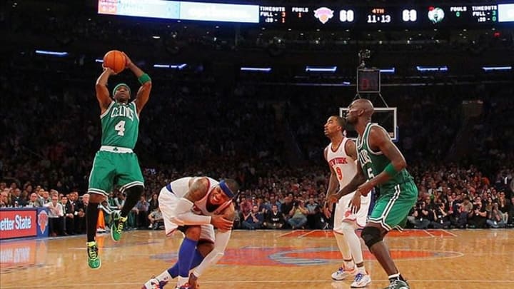 May 1, 2013; New York, NY, USA; Boston Celtics guard Jason Terry (4) shoots over an injured New York Knicks forward Carmelo Anthony (7) in front of guard J.R. Smith (8) and Celtics center Kevin Garnett (5) during the fourth quarter of game five of the first round of the 2013 NBA Playoffs at Madison Square Garden. Mandatory Credit: Brad Penner-USA TODAY Sports