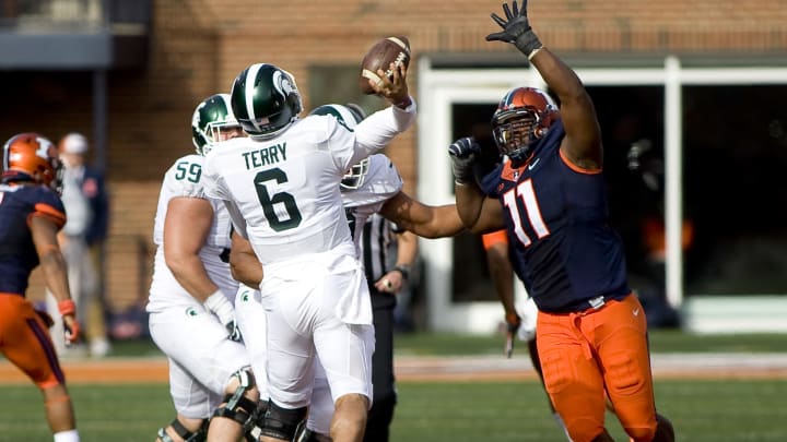 Nov 5, 2016; Champaign, IL, USA; Illinois Fighting Illini defensive lineman Chunky Clements (11) pressures Michigan State Spartans quarterback Damion Terry (6) on a throw during the fourth quarter at Memorial Stadium. Illinois beat Michigan State 31-27. Mandatory Credit: Mike Granse-USA TODAY Sports