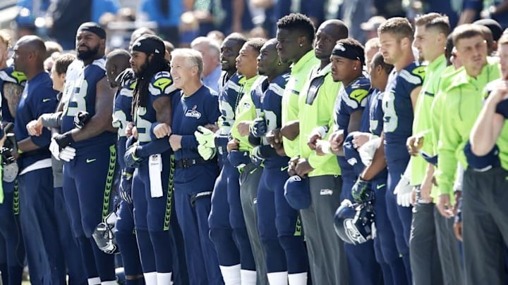 Sep 11, 2016; Seattle, WA, USA; Seattle Seahawks head coach Pete Carroll and cornerback Richard Sherman (25) stand together with other members of the Seahawks before kickoff against the Miami Dolphins at CenturyLink Field. Mandatory Credit: Joe Nicholson-USA TODAY Sports