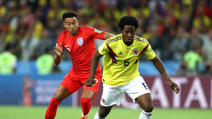 MOSCOW, RUSSIA - JULY 03: Carlos Sanchez of Colombia is challenged by Jesse Lingard of England during the 2018 FIFA World Cup Russia Round of 16 match between Colombia and England at Spartak Stadium on July 3, 2018 in Moscow, Russia. (Photo by Ryan Pierse/Getty Images)