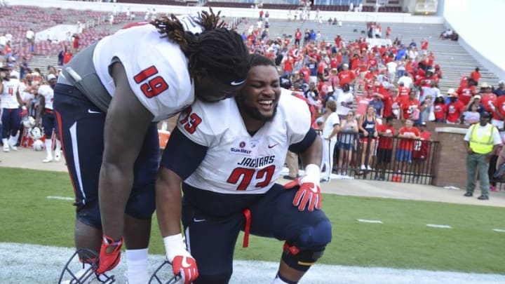 Sep 3, 2016; Starkville, MS, USA; South Alabama Jaguars defensive lineman Sir Calvin Wallace (19) and offensive lineman Steve McKenzie (73) react after the game against the Mississippi State Bulldogs at Davis Wade Stadium. South Alabama won 21-20. Mandatory Credit: Matt Bush-USA TODAY Sports
