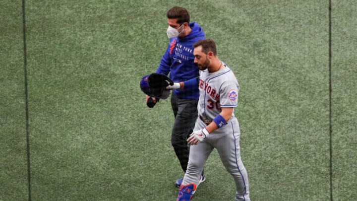 May 16, 2021; St. Petersburg, Florida, USA; New York Mets right fielder Michael Conforto (30) leaves the game against the Tampa Bay Rays in the first inning with an injury at Tropicana Field. Mandatory Credit: Nathan Ray Seebeck-USA TODAY Sports