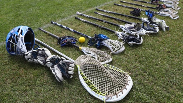 GUILDFORD, ENGLAND - JULY 20: Detail shot of lacrosse sticks, gloves,helmets, eye protectors ahead of the classification match between Japan and Italy during the 2017 FIL Rathbones Women's Lacrosse World Cup at Surrey Sports Park on July 20, 2017 in Guildford, England. (Photo by Michael Steele/Getty Images)
