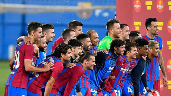 Barcelona's players celebrate after winning the 56th Joan Gamper Trophy friendly football match between Barcelona and Juventus at the Johan Cruyff Stadium in Sant Joan Despi near Barcelona on August 8, 2021. (Photo by Pau BARRENA / AFP) (Photo by PAU BARRENA/AFP via Getty Images)