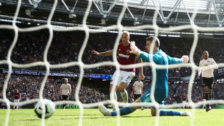 LONDON, ENGLAND - SEPTEMBER 29: Marko Arnautovic of West Ham United scores past David De Gea of Manchester United for his sides third goal during the Premier League match between West Ham United and Manchester United at London Stadium on September 29, 2018 in London, United Kingdom. (Photo by Warren Little/Getty Images)
