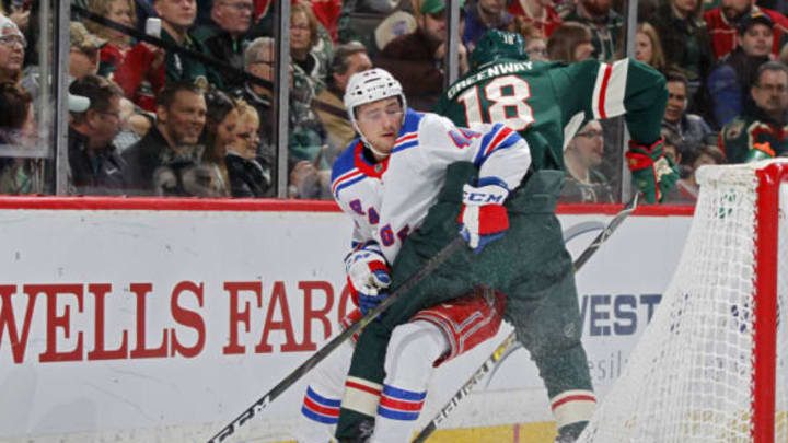 ST. PAUL, MN – MARCH 16: Jordan Greenway #18 of the Minnesota Wild bumps Neal Pionk #44 of the New York Rangers off of the puck during a game at Xcel Energy Center on March 16, 2019 in St. Paul, Minnesota.(Photo by Bruce Kluckhohn/NHLI via Getty Images)