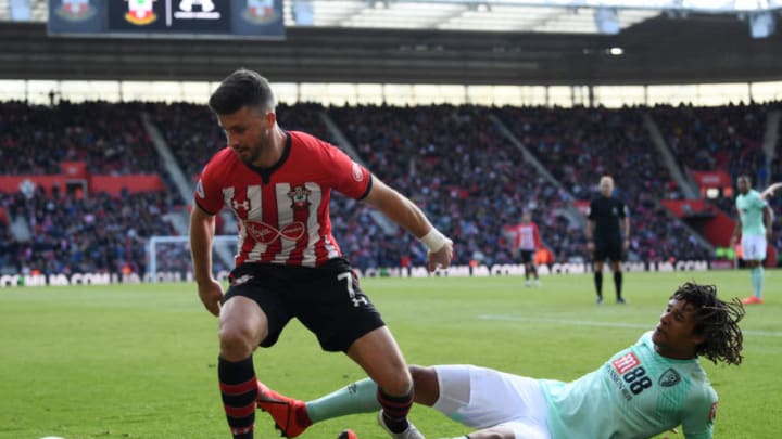 SOUTHAMPTON, ENGLAND - APRIL 27: Nathan Ake of AFC Bournemouth tackles Shane Long of Southampton during the Premier League match between Southampton FC and AFC Bournemouth at St Mary's Stadium on April 27, 2019 in Southampton, United Kingdom. (Photo by Stu Forster/Getty Images)