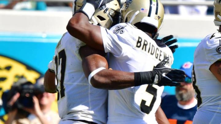 JACKSONVILLE, FLORIDA - OCTOBER 13: Jared Cook #87 and Teddy Bridgewater #5 of the New Orleans Saints celebrate after connecting for a touchdown during the fourth quarter of a football game against the Jacksonville Jaguars at TIAA Bank Field on October 13, 2019 in Jacksonville, Florida. (Photo by Julio Aguilar/Getty Images)
