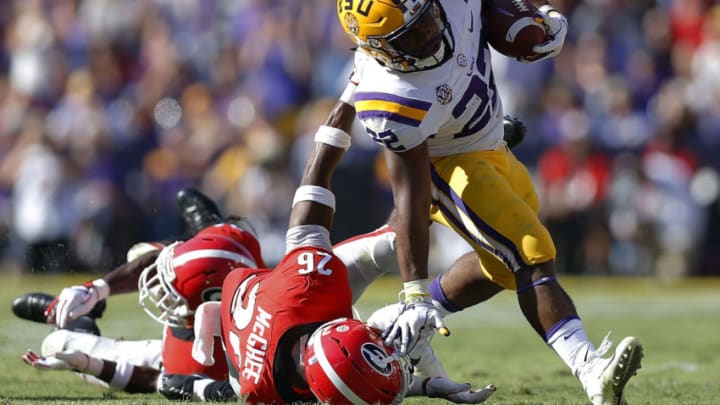 BATON ROUGE, LA - OCTOBER 13: Tyrique McGhee #26 of the Georgia Bulldogs tackles Clyde Edwards-Helaire #22 of the LSU Tigers during the first half at Tiger Stadium on October 13, 2018 in Baton Rouge, Louisiana. (Photo by Jonathan Bachman/Getty Images)