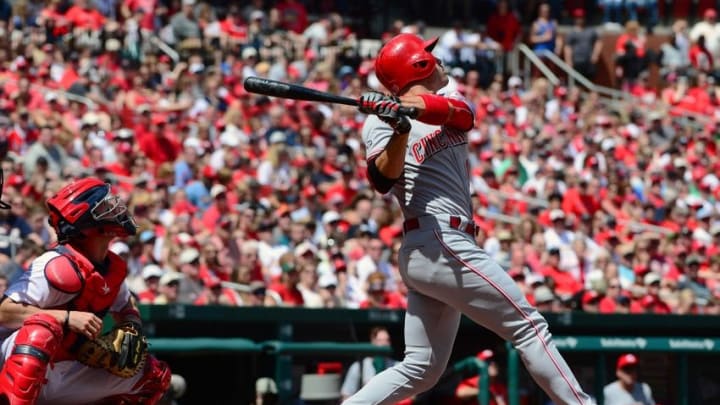 Apr 17, 2016; St. Louis, MO, USA; Cincinnati Reds first baseman Joey Votto (19) hits a one run sacrifice fly off St. Louis Cardinals starting pitcher Michael Wacha (not pictured) during the first inning at Busch Stadium. Mandatory Credit: Jeff Curry-USA TODAY Sports