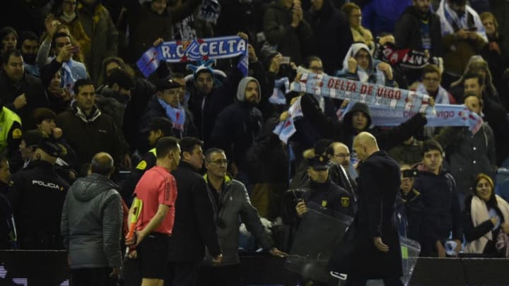 Real Madrid's French coach Zinedine Zidane (R) leaves the pitch at the end of the Spanish Copa del Rey (King's Cup) quarter final second leg football match RC Celta de Vigo vs Real Madrid CF RC Celta de Vigo on January 25, 2017.A fine free-kick from Cristiano Ronaldo couldn't prevent Real Madrid from being dumped out of the Copa del Rey as a 2-2 draw at Celta Vigo today allowed the hosts to progress to the semi-finals 4-3 on aggregate. / AFP / MIGUEL RIOPA (Photo credit should read MIGUEL RIOPA/AFP/Getty Images)