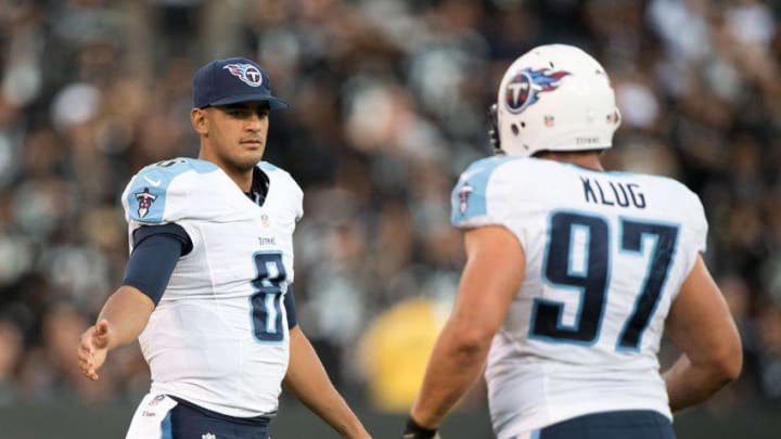 August 27, 2016; Oakland, CA, USA; Tennessee Titans quarterback Marcus Mariota (8) congratulates defensive end Karl Klug (97) during the third quarter against the Oakland Raiders at Oakland Coliseum. The Titans defeated the Raiders 27-14. Mandatory Credit: Kyle Terada-USA TODAY Sports