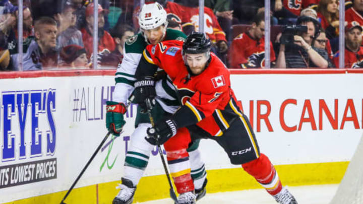 Feb 1, 2017; Calgary, Alberta, CAN; Calgary Flames defenseman TJ Brodie (7) and Minnesota Wild right wing Jason Pominville (29) battle for the puck during the first period at Scotiabank Saddledome. Mandatory Credit: Sergei Belski-USA TODAY Sports