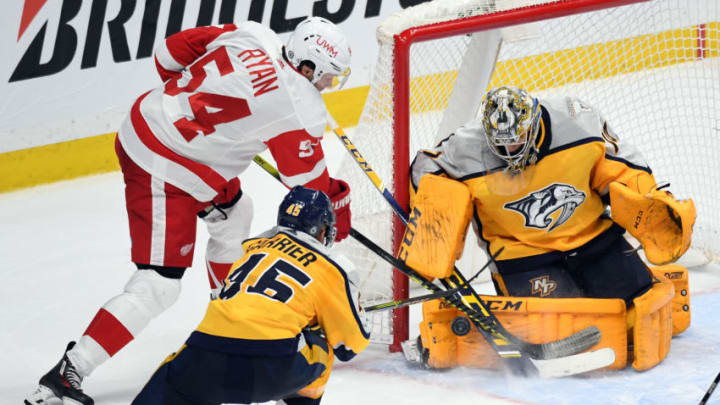 Nashville Predators goaltender Juuse Saros (74) makes a save on a shot by Detroit Red Wings right wing Bobby Ryan (54) Mandatory Credit: Christopher Hanewinckel-USA TODAY Sports