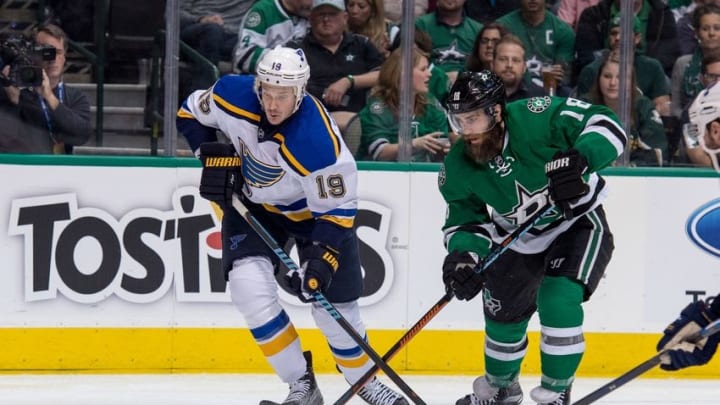 Apr 29, 2016; Dallas, TX, USA; St. Louis Blues defenseman Jay Bouwmeester (19) and Dallas Stars right wing Patrick Eaves (18) chase the puck during game one of the second round of the 2016 Stanley Cup Playoffs at the American Airlines Center. The Stars defeat the Blue 2-1. Mandatory Credit: Jerome Miron-USA TODAY Sports
