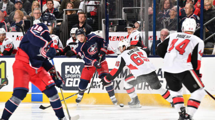 COLUMBUS, OH - NOVEMBER 24: Artemi Panarin #9 of the Columbus Blue Jackets passes the puck away from Erik Karlsson #65 of the Ottawa Senators during the third period of a game on November 24, 2017 at Nationwide Arena in Columbus, Ohio. (Photo by Jamie Sabau/NHLI via Getty Images)