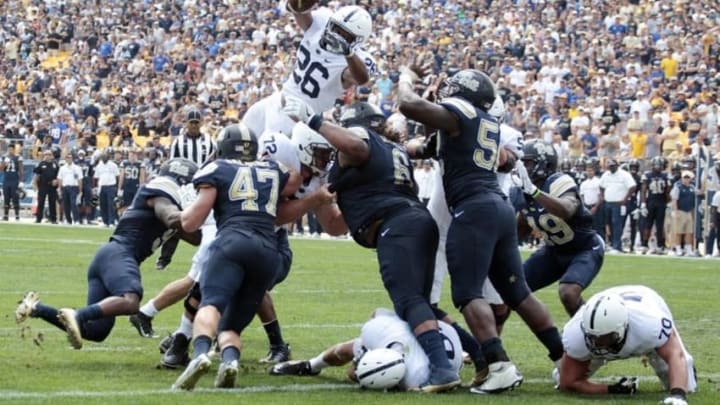 Sep 10, 2016; Pittsburgh, PA, USA; Penn State Nittany Lions running back Saquon Barkley (26) dives over the line of scrimmage into the end-zone for a touchdown against the Pittsburgh Panthers during the second quarter at Heinz Field. Mandatory Credit: Charles LeClaire-USA TODAY Sports