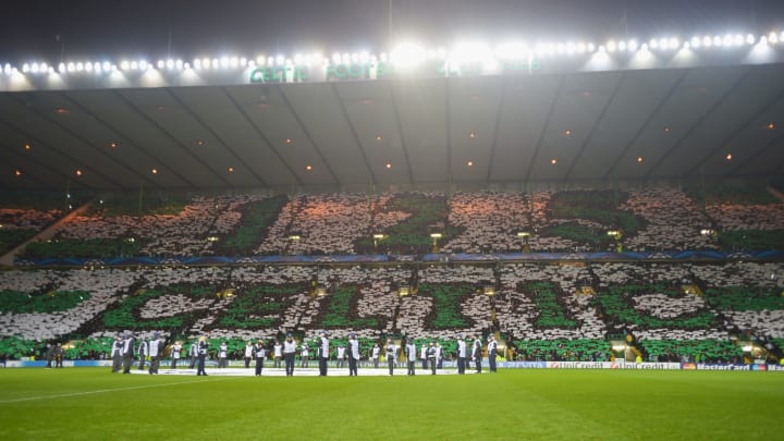 GLASGOW, SCOTLAND – NOVEMBER 07: Celtic fans hold up cards to spell out a sign during the UEFA Champions League Group G match between Celtic and Barcelona at Celtic Park on November 7, 2012 in Glasgow, Scotland. (Photo by Jeff J Mitchell/Getty Images)
