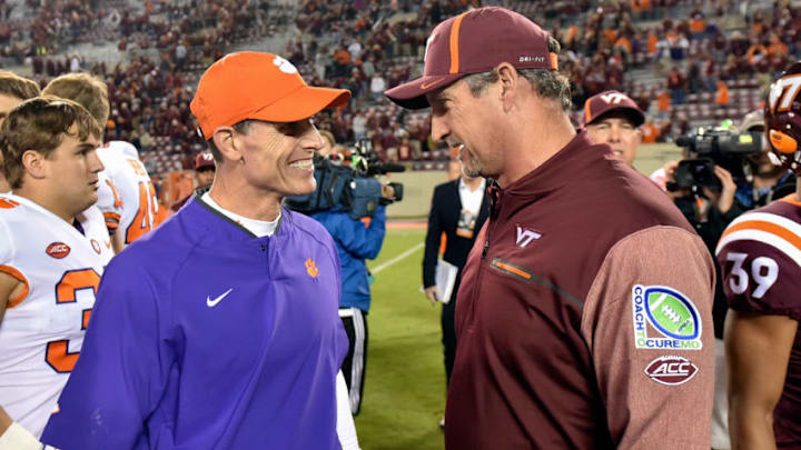 BLACKSBURG, VA - SEPTEMBER 30: (L-R) Clemson Tigers defensive coordinator Brent Venables and Virginia Tech Hokies defensive coordinator Bud Foster talk on the field after their game at Lane Stadium on September 30, 2017 in Blacksburg, Virginia. (Photo by Michael Shroyer/Getty Images)