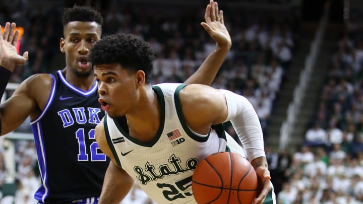 EAST LANSING, MICHIGAN – DECEMBER 03: Malik Hall #25 of the Michigan State Spartans tries to get around Javin DeLaurier #12 of the Duke Blue Devils during the first half at Breslin Center on December 03, 2019 in East Lansing, Michigan. (Photo by Gregory Shamus/Getty Images)