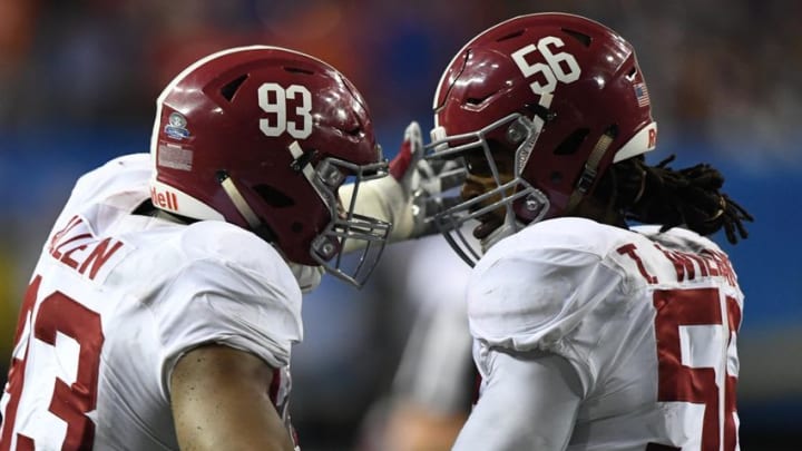 Dec 3, 2016; Atlanta, GA, USA; Alabama Crimson Tide defensive lineman Jonathan Allen (93) celebrates with linebacker Tim Williams (56) during the fourth quarter of the SEC Championship college football game against the Florida Gators at Georgia Dome. Alabama defeated Florida 54-16. Mandatory Credit: John David Mercer-USA TODAY Sports