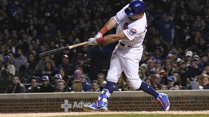 CHICAGO, IL – APRIL 26: Kyle Schwarber #12 of the Chicago Cubs hits a home run against the Milwaukee Brewers during the sixth inning on April 26, 2018 at Wrigley Field in Chicago, Illinois. (Photo by David Banks/Getty Images)