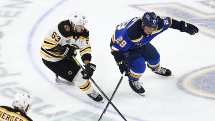 ST LOUIS, MISSOURI - JUNE 09: Brad Marchand #63 of the Boston Bruins battles for the puck with Vince Dunn #29 of the St. Louis Blues during the third period in Game Six of the 2019 NHL Stanley Cup Final at Enterprise Center on June 09, 2019 in St Louis, Missouri. (Photo by Dilip Vishwanat/Getty Images)