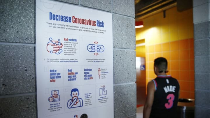 MIAMI, FLORIDA - MARCH 11: A detailed view of a coronavirus poster outside men's restroom prior to the game between the Miami Heat and the Charlotte Hornets at American Airlines Arena on March 11, 2020 in Miami, Florida. NOTE TO USER: User expressly acknowledges and agrees that, by downloading and/or using this photograph, user is consenting to the terms and conditions of the Getty Images License Agreement. (Photo by Michael Reaves/Getty Images)