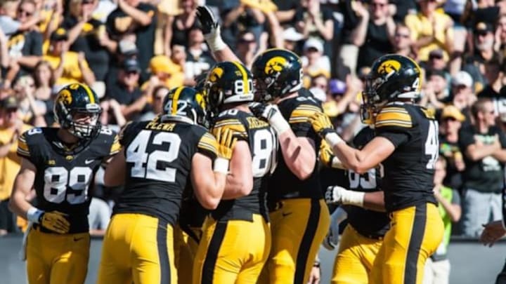 Sep 26, 2015; Iowa City, IA, USA; The Iowa Hawkeyes celebrate a touchdown during the second quarter against the North Texas Mean Green at Kinnick Stadium. Mandatory Credit: Jeffrey Becker-USA TODAY Sports