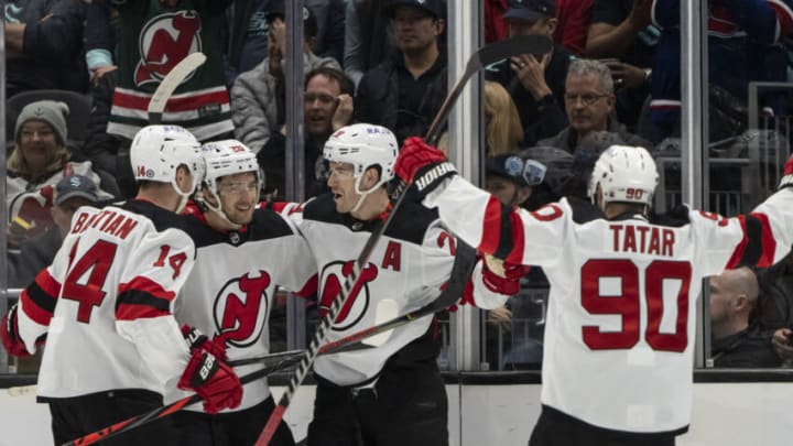 New Jersey Devils, from left, forward Nathan Bastian (14), forward Michael McLeod (20), defenseman Colton White (2) and forward Tomas Tatar (90) celebrate a goal during the third period against the Seattle Kraken at Climate Pledge Arena. Mandatory Credit: Stephen Brashear-USA TODAY Sports