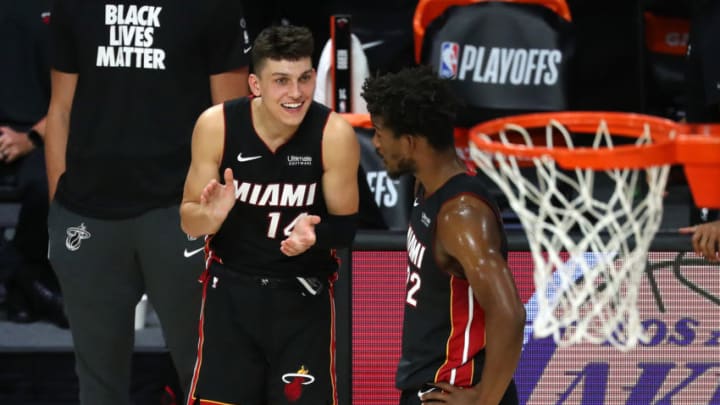 Miami Heat guard Tyler Herro (14) and forward Jimmy Butler (22) celebrate after defeating Milwaukee Bucks in game five(Kim Klement-USA TODAY Sports)