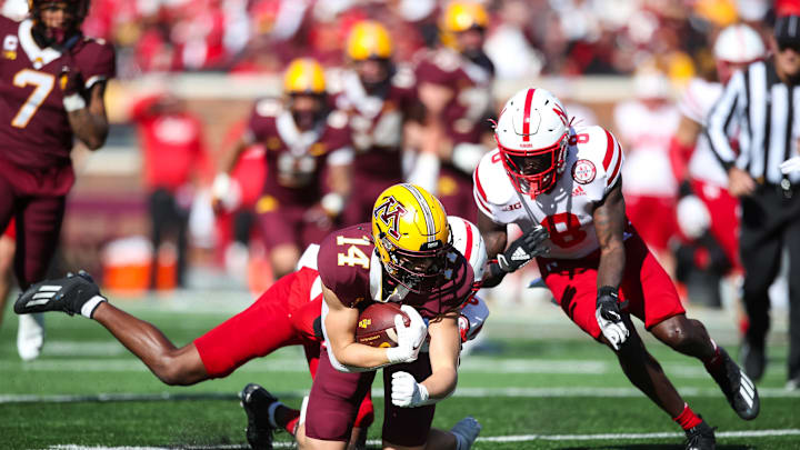 MINNEAPOLIS, MN – OCTOBER 16: Brady Boyd #14 of the Minnesota Golden Gophers is tackled by Quinton Newsome #6 and Deontai Williams #8 of the Nebraska Cornhuskers after catching a pass in the first quarter of the game at Huntington Bank Stadium on October 16, 2021 in Minneapolis, Minnesota. (Photo by David Berding/Getty Images)